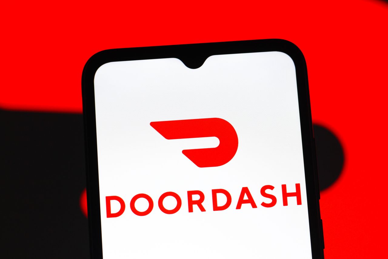 In this photo illustration, the DoorDash logo is seen displayed on a smartphone screen.