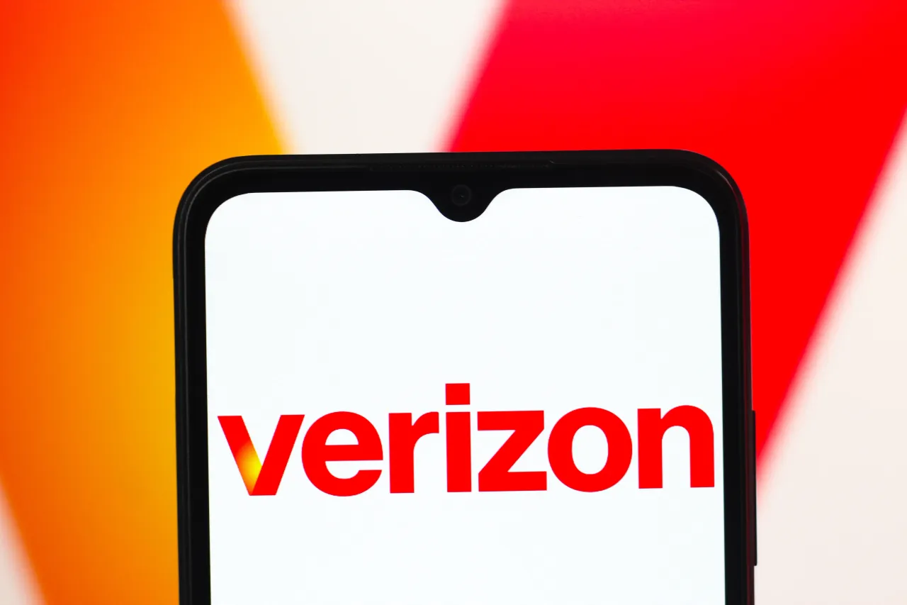 In this photo illustration, the Verizon Communications logo is seen displayed on a smartphone screen. 