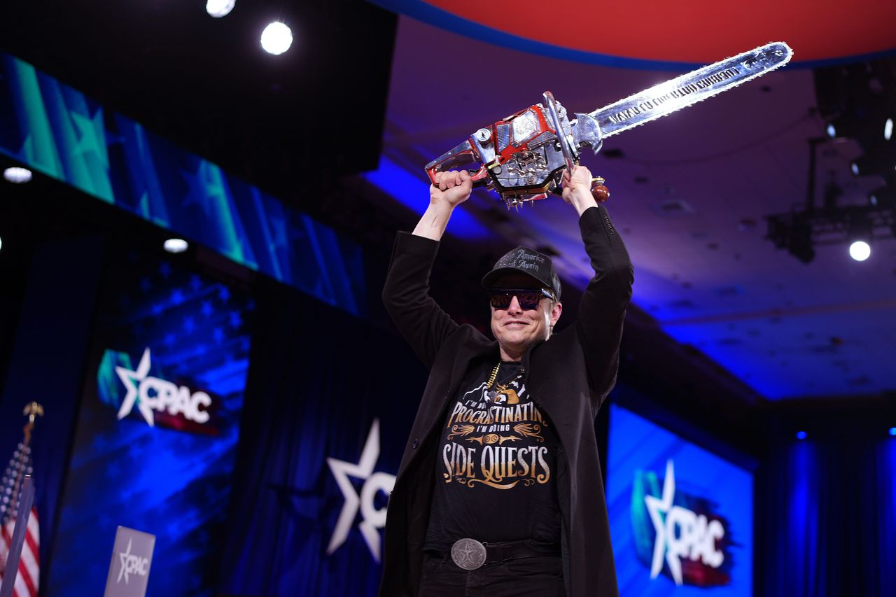 CEO of Tesla and SpaceX Elon Musk leaves the stage holding a chainsaw after speaking at the Conservative Political Action Conference (CPAC) at the Gaylord National Resort Hotel And Convention Center on February 20, 2025 in Oxon Hill, Maryland. (Photo by Andrew Harnik/Getty Images)