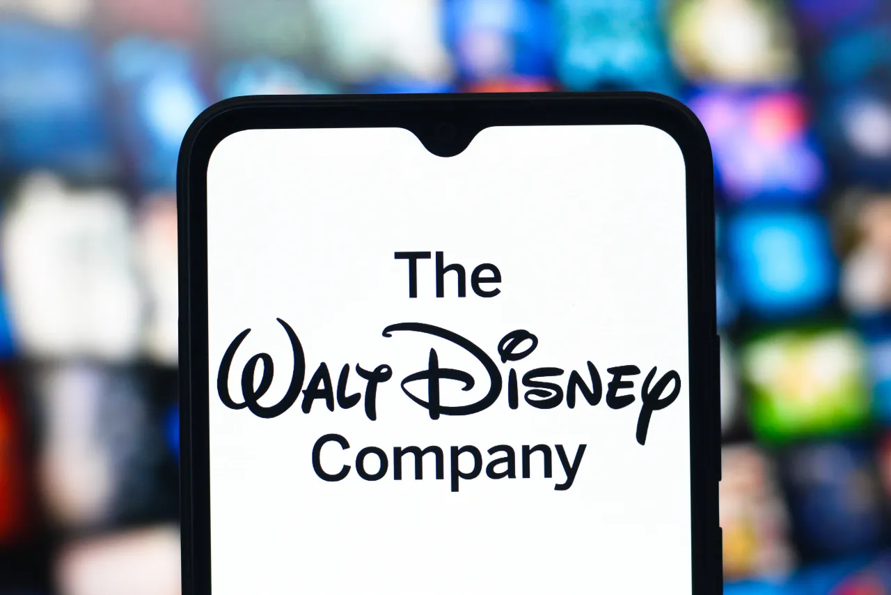 In this photo illustration, the Walt Disney Company logo is seen displayed on a smartphone screen. 