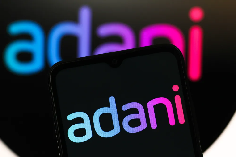 In this photo illustration, the Adani Enterprises logo is seen displayed on a smartphone screen. (Photo Illustration by Thomas Fuller/SOPA Images/LightRocket via Getty Images)