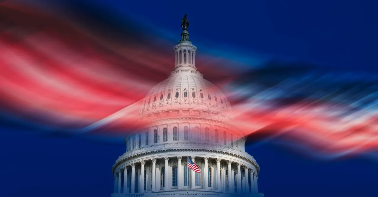 USA, Washington D.C., United States Capitol building and blurred American flag against blue sky