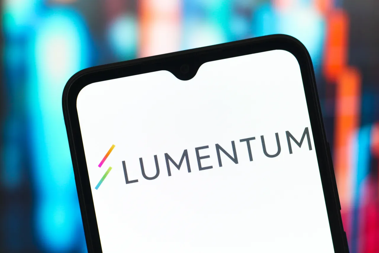 In this photo illustration, the Lumentum Holdings logo is seen displayed on a smartphone screen. (Photo Illustration by Thomas Fuller/SOPA Images/LightRocket via Getty Images)