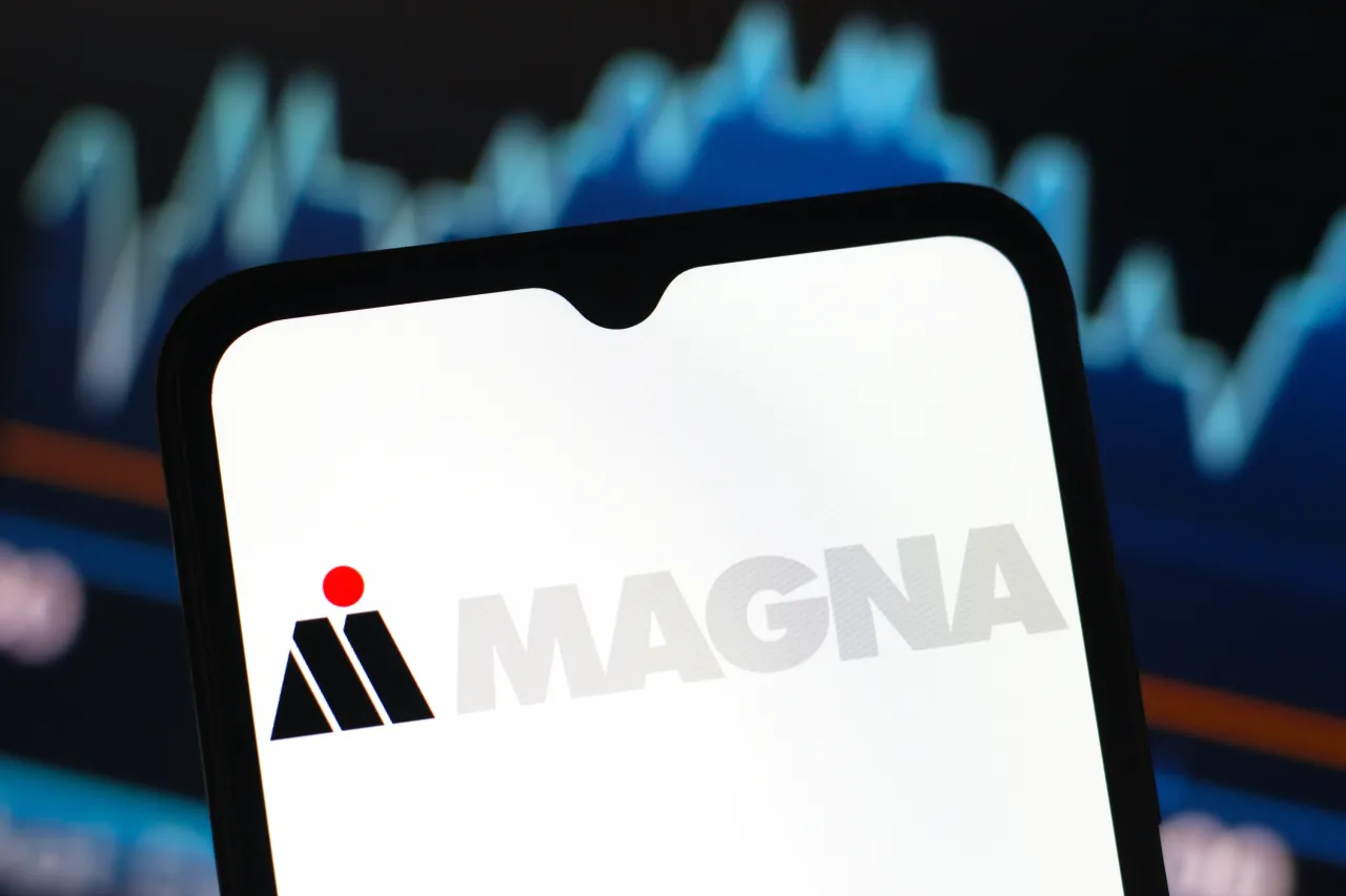 In this photo illustration, the Magna International logo is seen displayed on a smartphone screen. (Photo Illustration by Thomas Fuller/SOPA Images/LightRocket via Getty Images)
