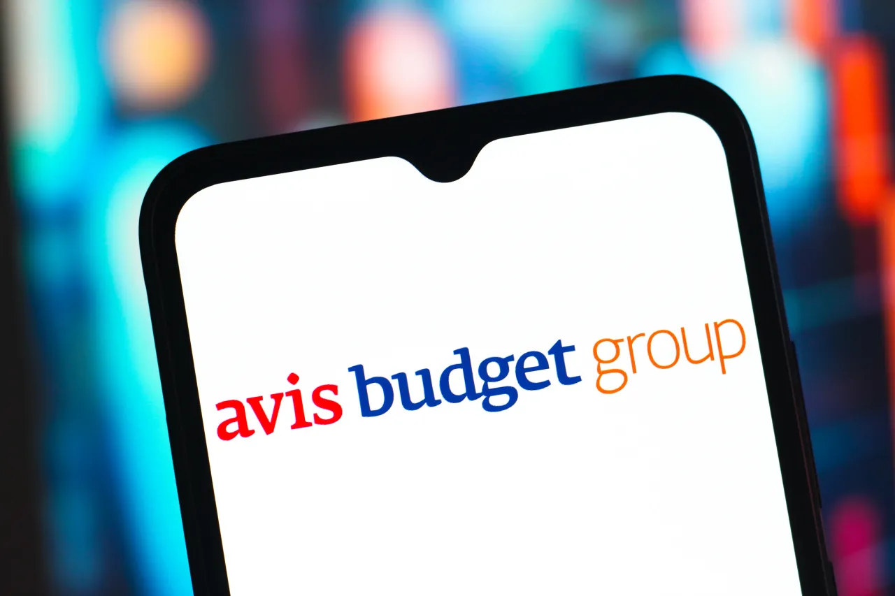The Avis Budget Group logo is seen displayed on a smartphone screen. (Photo Illustration by Thomas Fuller/SOPA Images/LightRocket via Getty Images)