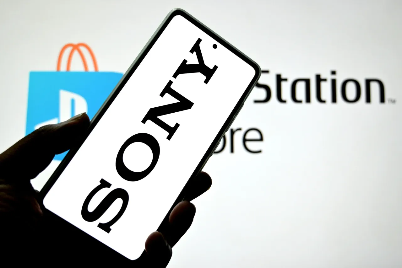 Sony logo is seen displayed on a smartphone with a Sony Play Station Store logo in the background. (Photo Illustration by Avishek Das/SOPA Images/LightRocket via Getty Images)