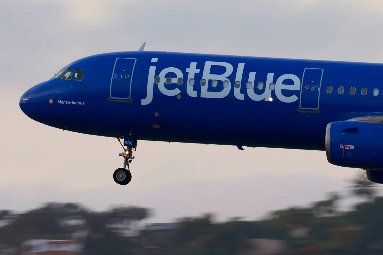 A JetBlue Airways Airbus A321 airplane approaches San Diego International Airport for a landing from Boston on April 20, 2025 in San Diego, California. 