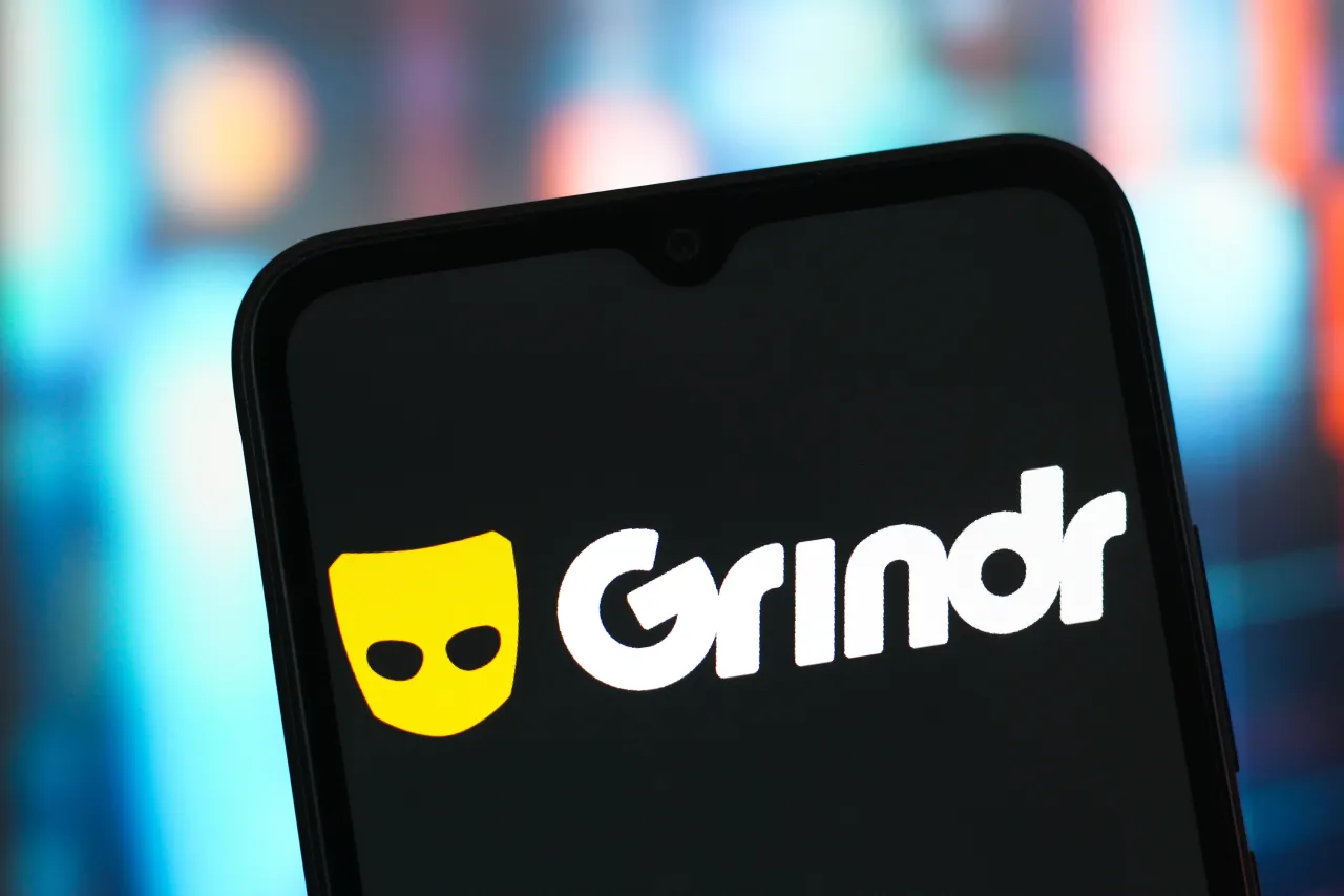 The Grindr logo is seen displayed on a smartphone screen. The company receives takeover interest from top shareholders, James Lu and Ray Zage. (Photo Illustration by Thomas Fuller/SOPA Images/LightRocket via Getty Images)