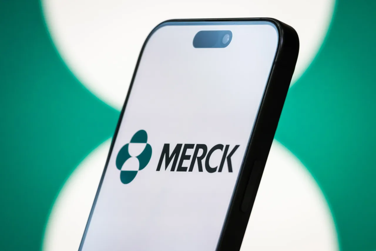 In this photo illustration, the Merck logo is displayed on a smartphone screen, with the company's green-themed branding visible in the background, on April 20, 2025, in Chongqing, China. (Photo by Cheng Xin/Getty Images)