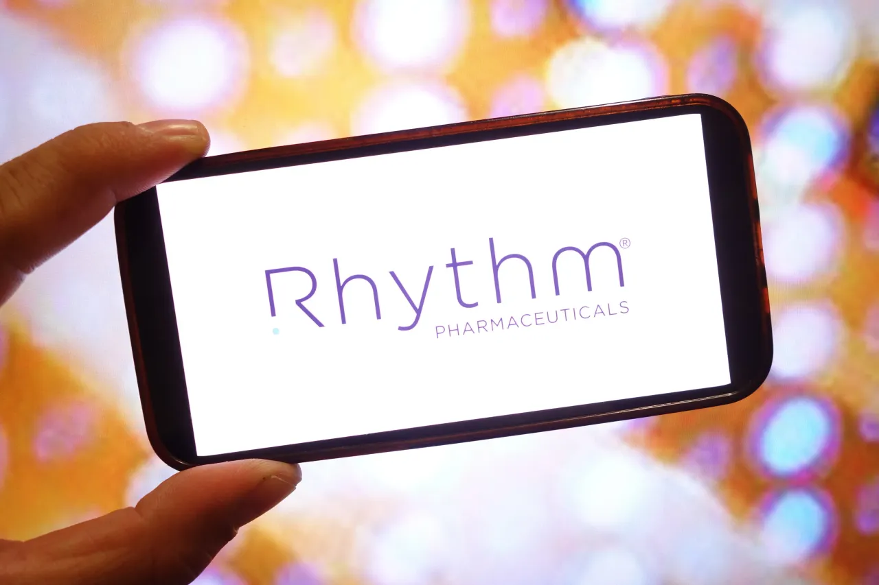 In this photo illustration, the Rhythm Pharmaceuticals company logo is seen displayed on a smartphone screen. (Photo Illustration by Piotr Swat/SOPA Images/LightRocket via Getty Images)