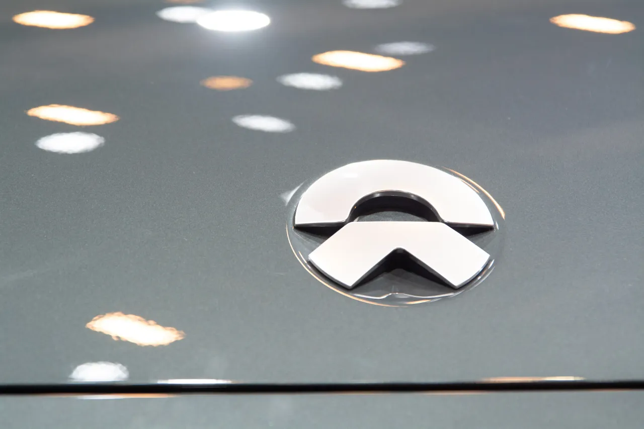The Nio logo is seen at the NIO booth in the National Exhibition Center in Shanghai, China, on April 28, 2025, during the Shanghai Automobile Show 2025. (Photo by Ying Tang/NurPhoto via Getty Images)