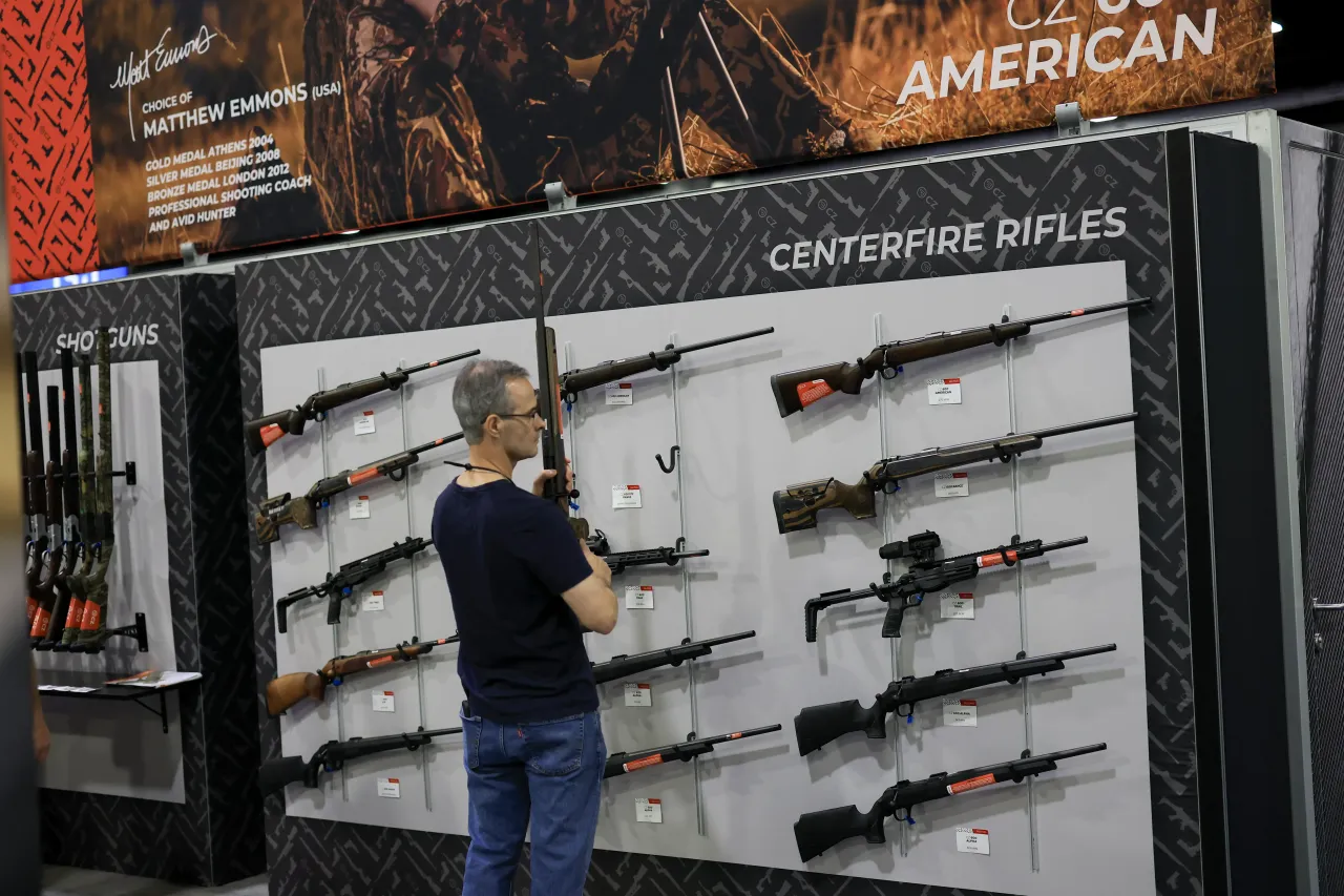 A visitor looks at firearms on display at the 2025 NRA Annual Meetings & Exhibits held in the Georgia World Congress Center on April 26, 2025 in Atlanta, Georgia. (Photo by Joe Raedle/Getty Images)