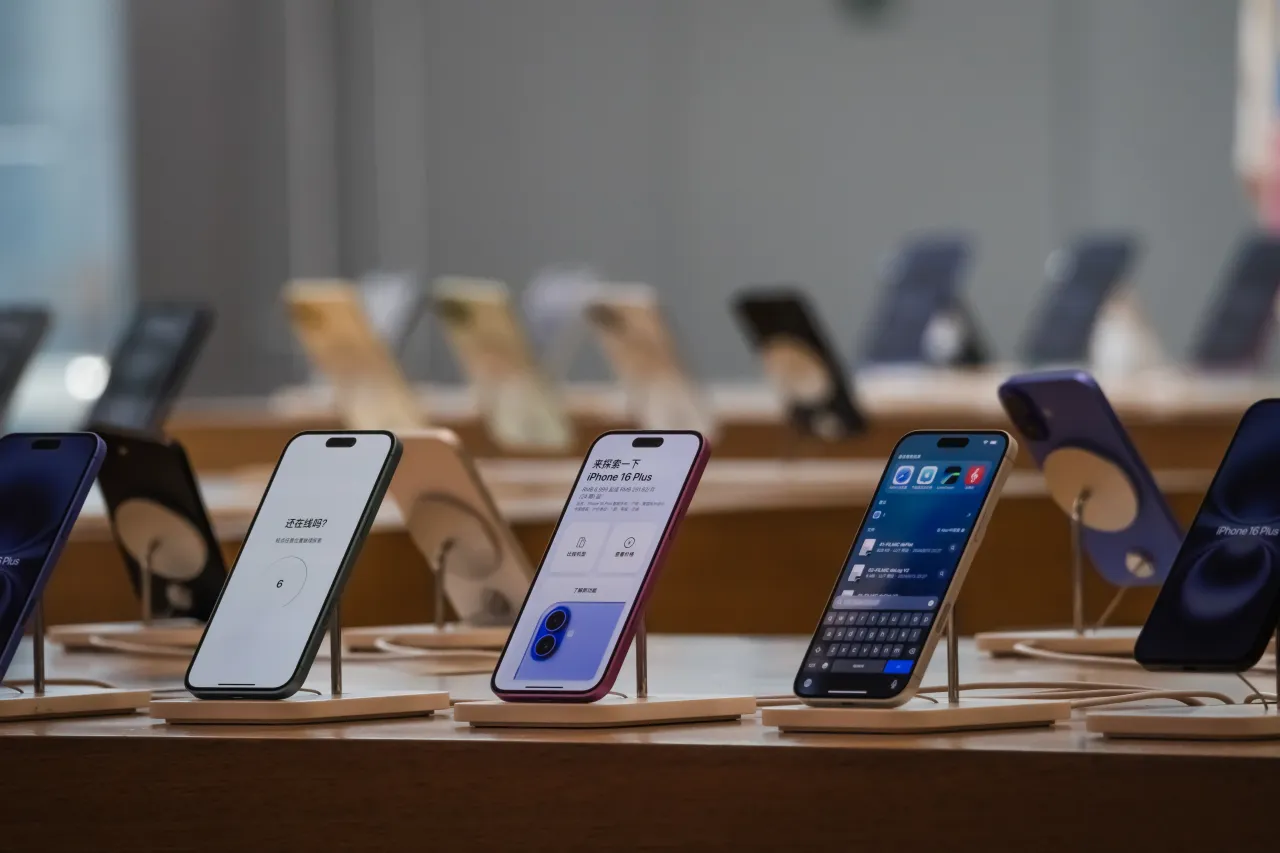 iPhone 16 and iPhone 16 Plus models are displayed at an Apple Store. (Photo by Cheng Xin/Getty Images)