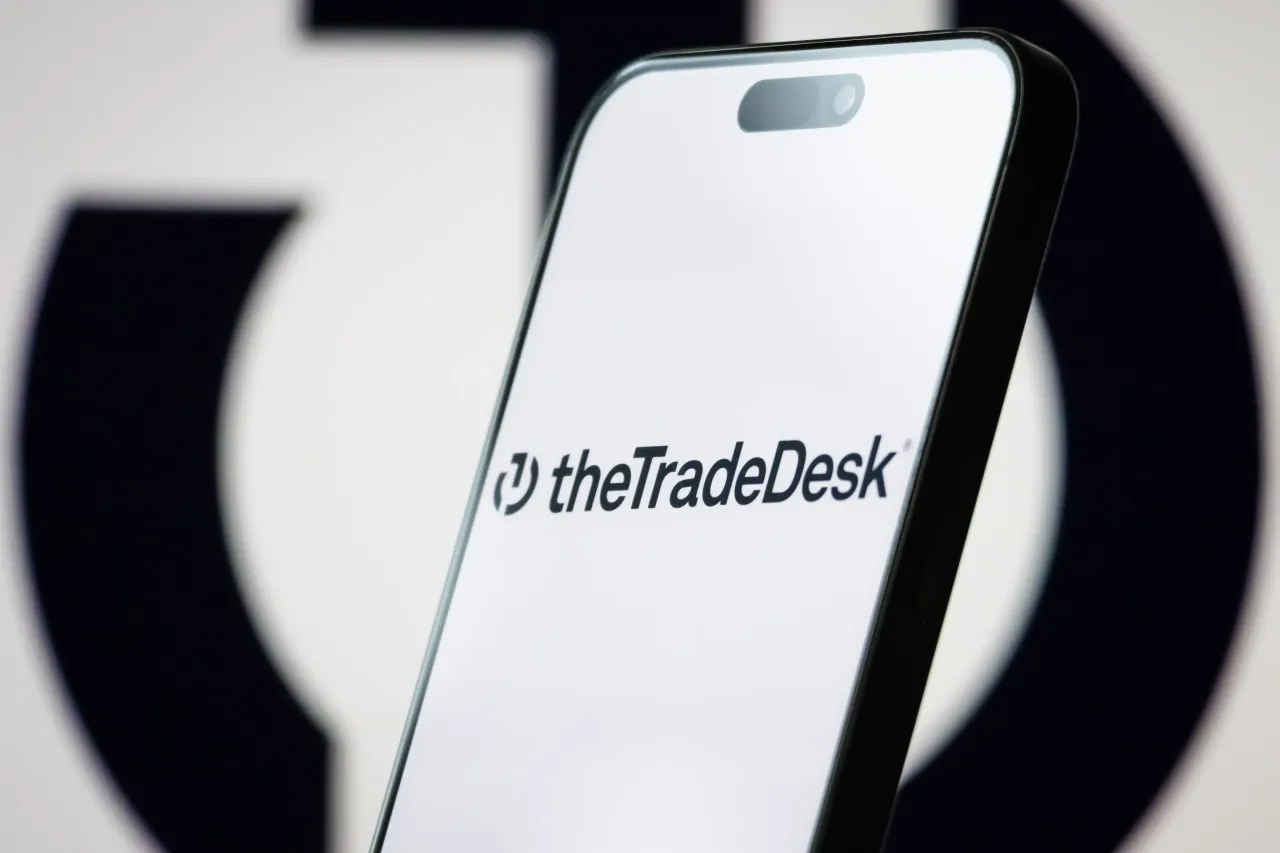 The logo of The Trade Desk, Inc. is displayed on a smartphone screen, with the company's branding visible in the background. (Photo illustration by Cheng Xin/Getty Images)
