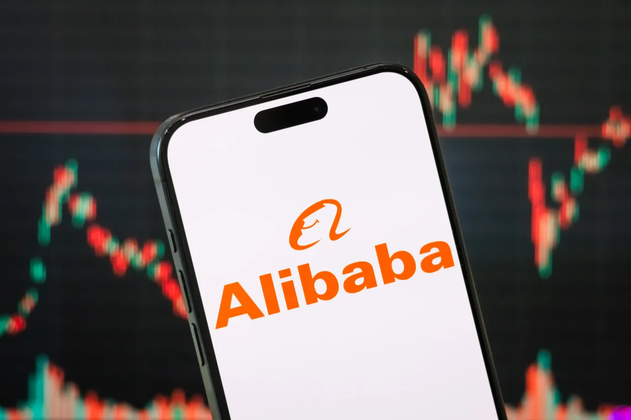 The logo of Alibaba Group is displayed on a smartphone screen. (Photo illustration by Cheng Xin/Getty Images)