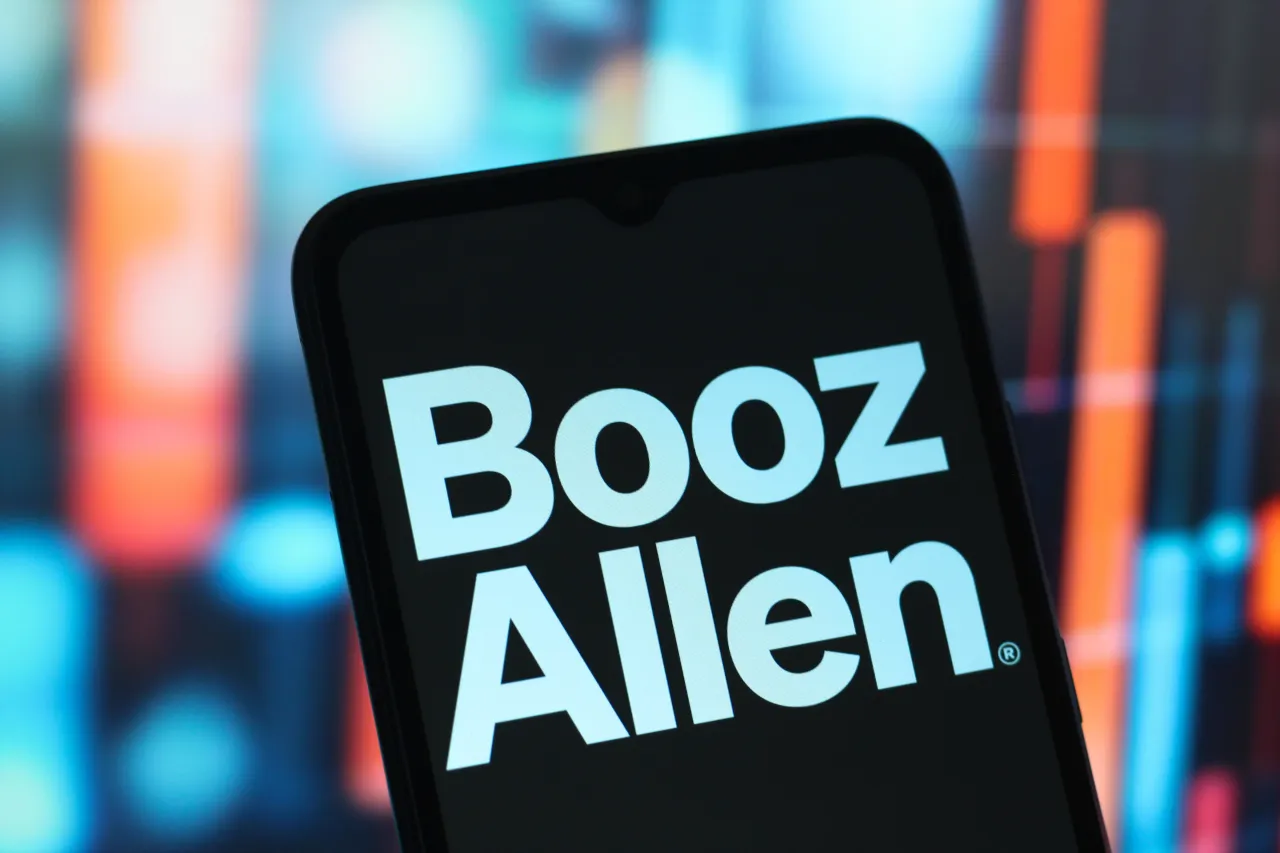 n this photo illustration, the Booz Allen Hamilton logo is seen displayed on a smartphone screen. (Photo Illustration by Thomas Fuller/SOPA Images/LightRocket via Getty Images)