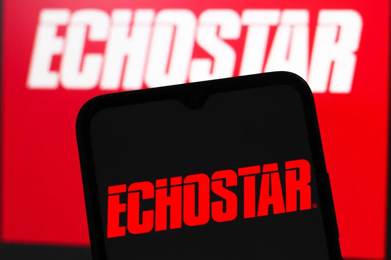 In this photo illustration, the EchoStar Corporation (Echo Star) logo is seen displayed on a smartphone screen. (Photo Illustration by Thomas Fuller/SOPA Images/LightRocket via Getty Images)