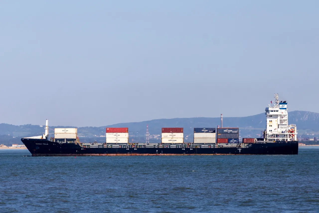 A cargo ship loaded with containers sails near the coast in Lisbon, Portugal, on May 24, 2025. Trump's proposed 50% tariff on EU goods alarms exporters in Germany, Ireland, and Italy. (Photo by Luis Boza/NurPhoto via Getty Images)