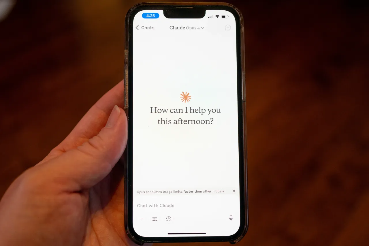 Close-up of a person's hand holding a smartphone the Claude app from AI company Anthropic. (Photo by Smith Collection/Gado/Getty Images)