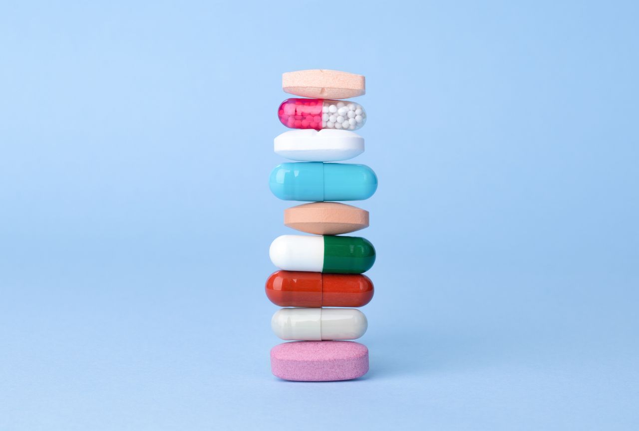 Assorted pharmaceutical drugs balancing on each other, conceptional idea .