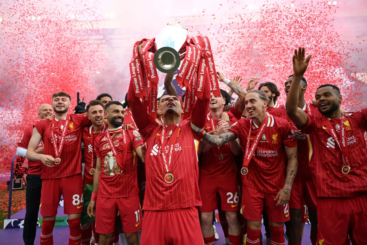 Virgil van Dijk of Liverpool, lifts the Premier League trophy, as Liverpool are crowned the Champions of the Premier League for the 2024/25 Season.