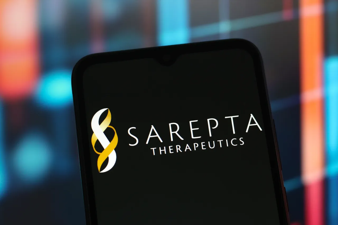 In this photo illustration, the Sarepta Therapeutics logo is seen displayed on a smartphone screen. (Photo Illustration by Thomas Fuller/SOPA Images/LightRocket via Getty Images)