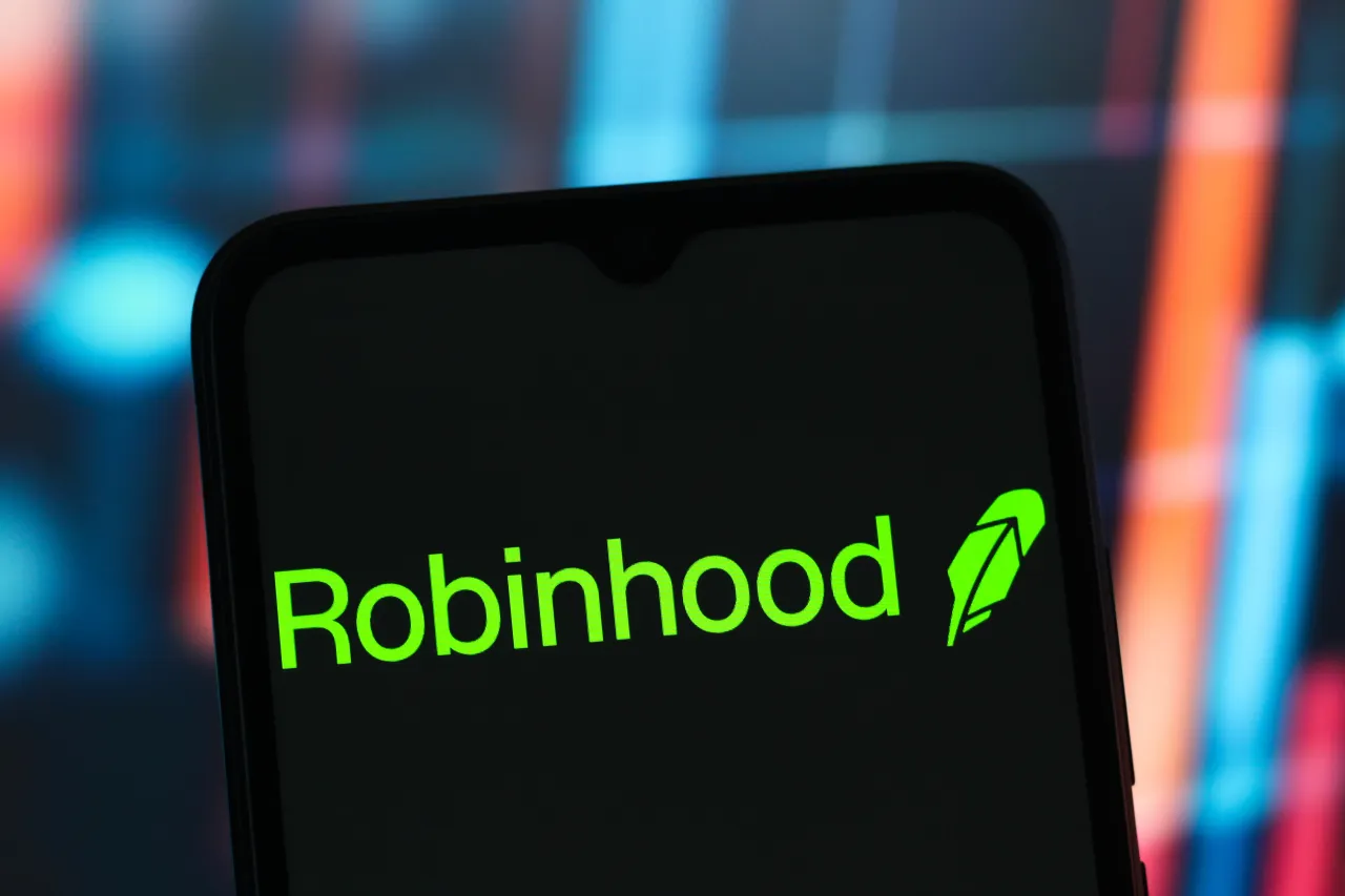 In this photo illustration, the Robinhood Markets logo is seen displayed on a smartphone screen. 