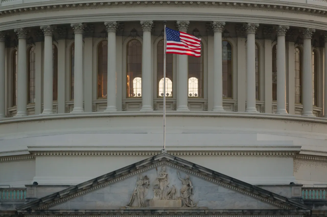 An American flag waves at the U.S. Capitol Building as the sun sets on June 10, 2025 in Washington, DC. (Photo by Kevin Carter/Getty Images)