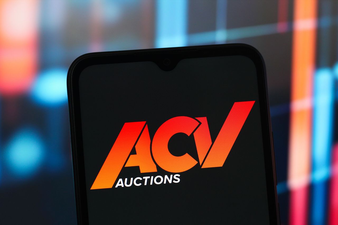 In this photo illustration, the ACV Auctions logo is seen displayed on a smartphone screen. (Photo Illustration by Thomas Fuller/SOPA Images/LightRocket via Getty Images)