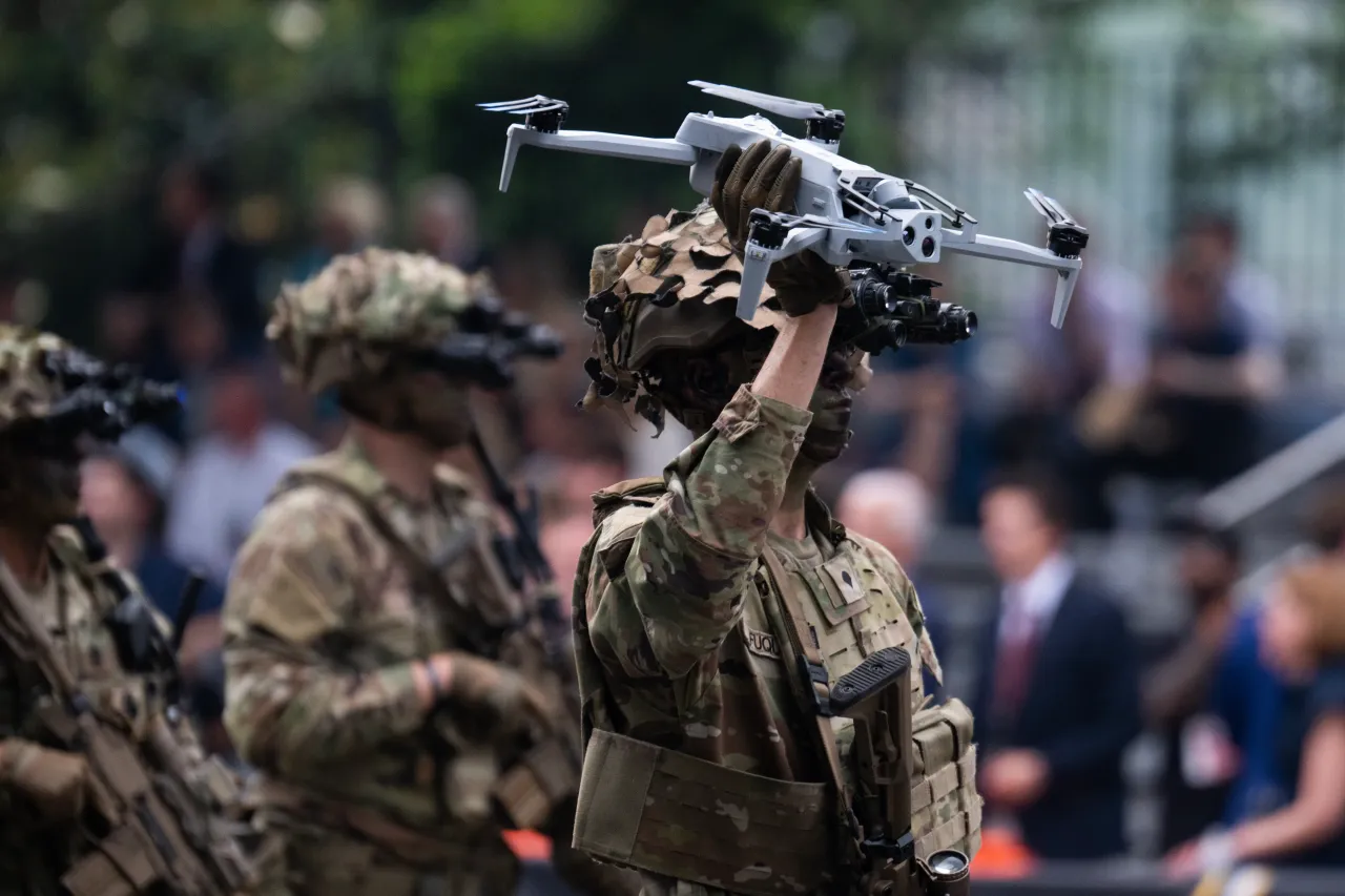A soldier holds a drone in the U.S. Army's 250th anniversary parade on Constitution Avenue, NW. (Tom Williams/CQ-Roll Call, Inc via Getty Images)