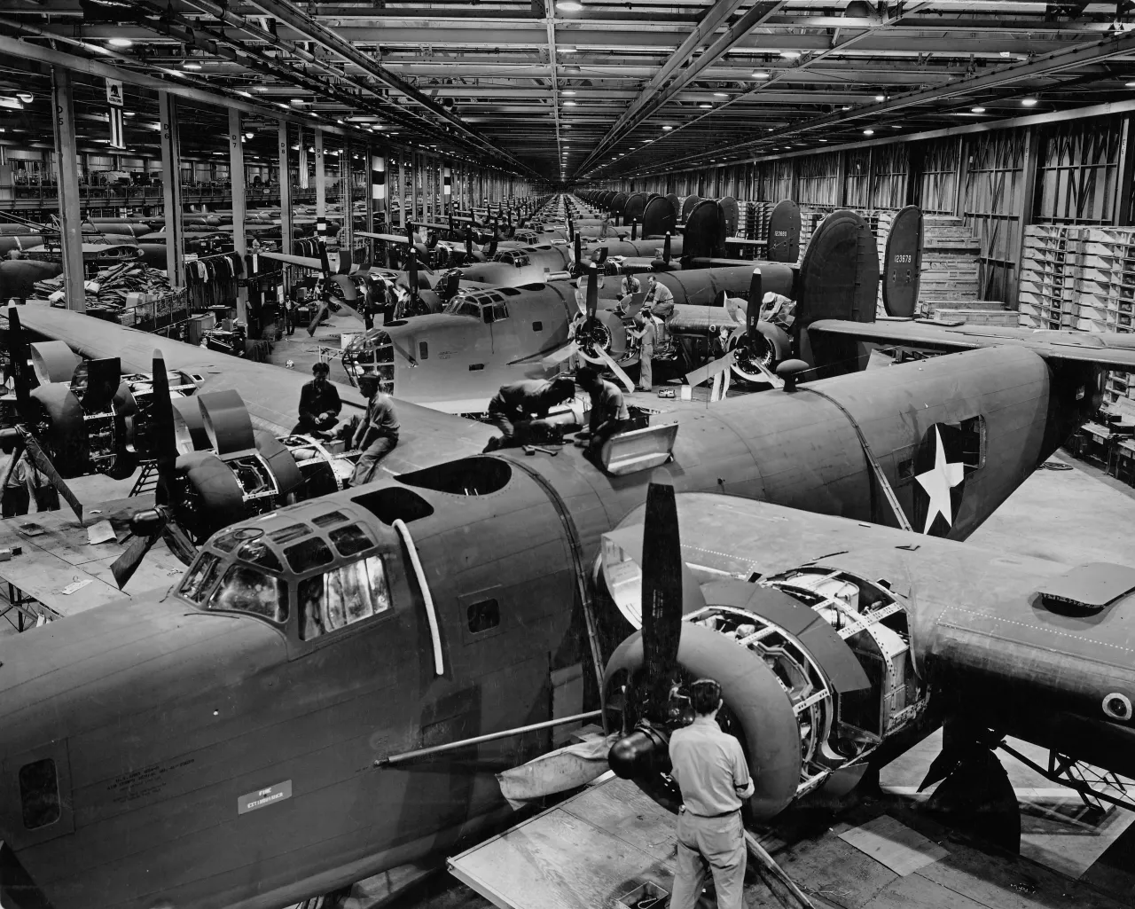 Components for the Consolidated B-24 -E Liberator four-engined heavy bomber being assembled at the Ford Willow Run B-24 Liberty Bomber aircraft assembly plant, c. December 1942, near Detroit. (Photo by Archive Photos/Getty Images)
