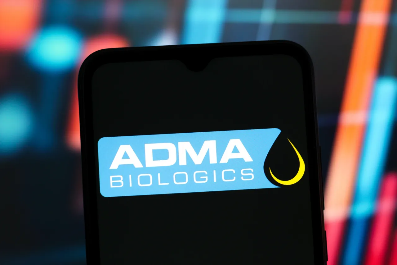 In this photo illustration, the ADMA Biologics logo is seen displayed on a smartphone screen. (Photo Illustration by Thomas Fuller/SOPA Images/LightRocket via Getty Images)