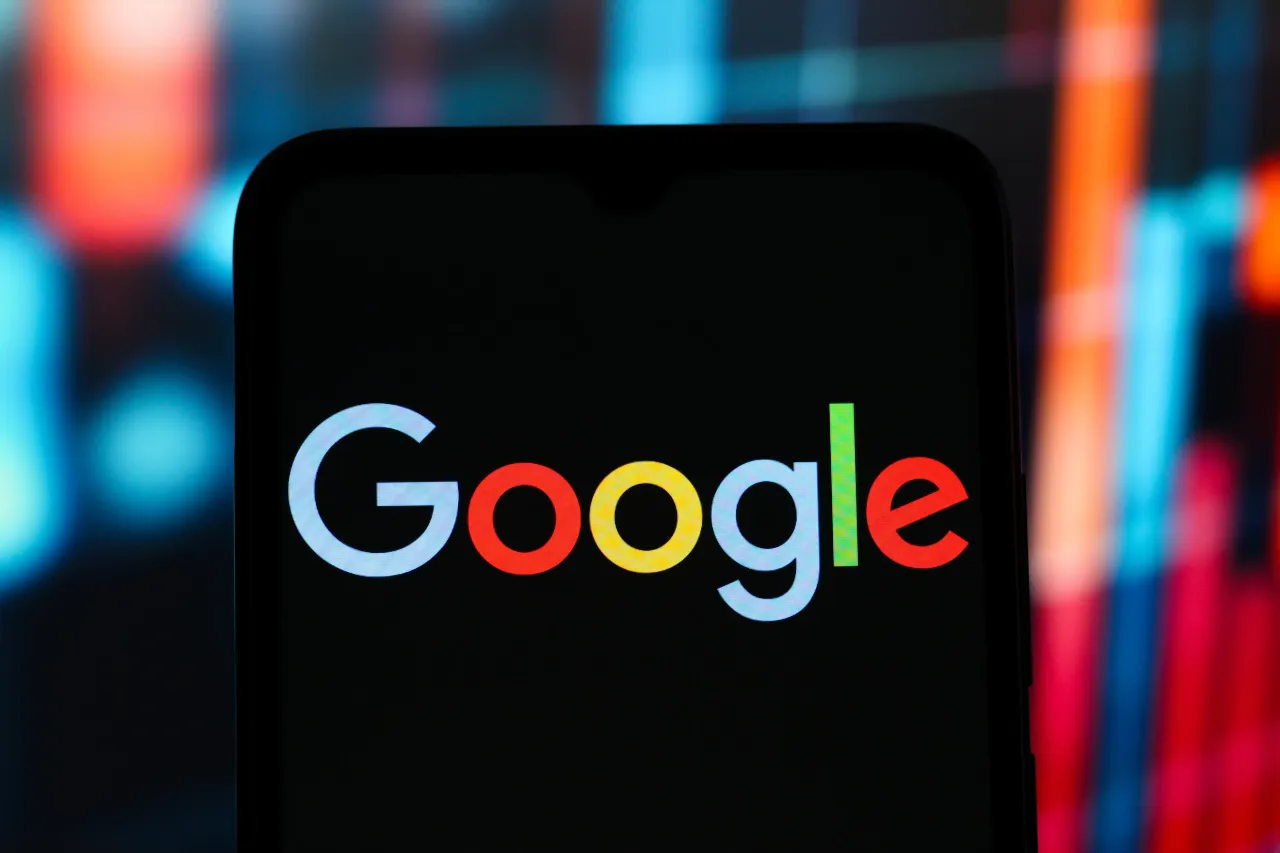 In this photo illustration, the Google logo is seen displayed on a smartphone screen. 