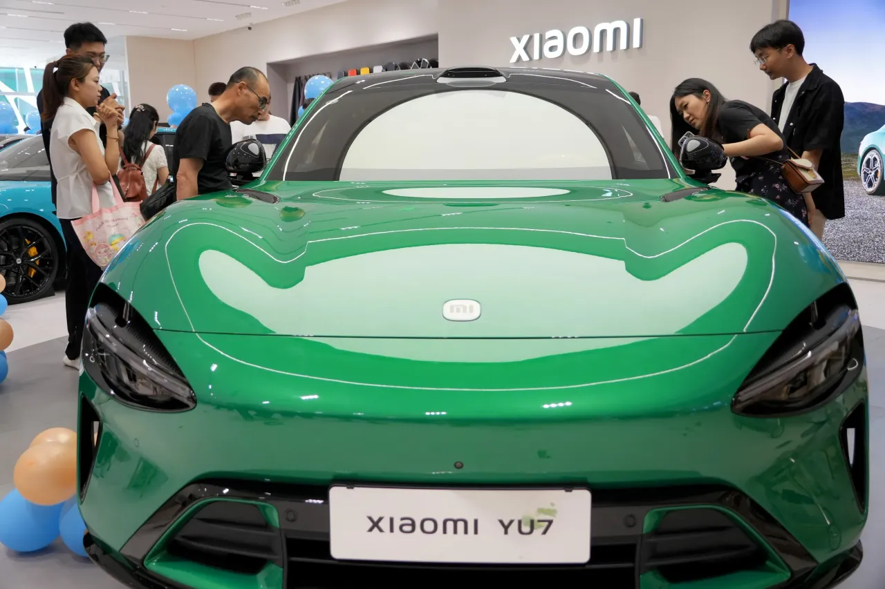 Consumers learn about a Xiaomi YU7 electric vehicle at a Xiaomi Home in Yantai City, Shandong Province, China, on June 21, 2025. (Photo by Costfoto/NurPhoto via Getty Images)