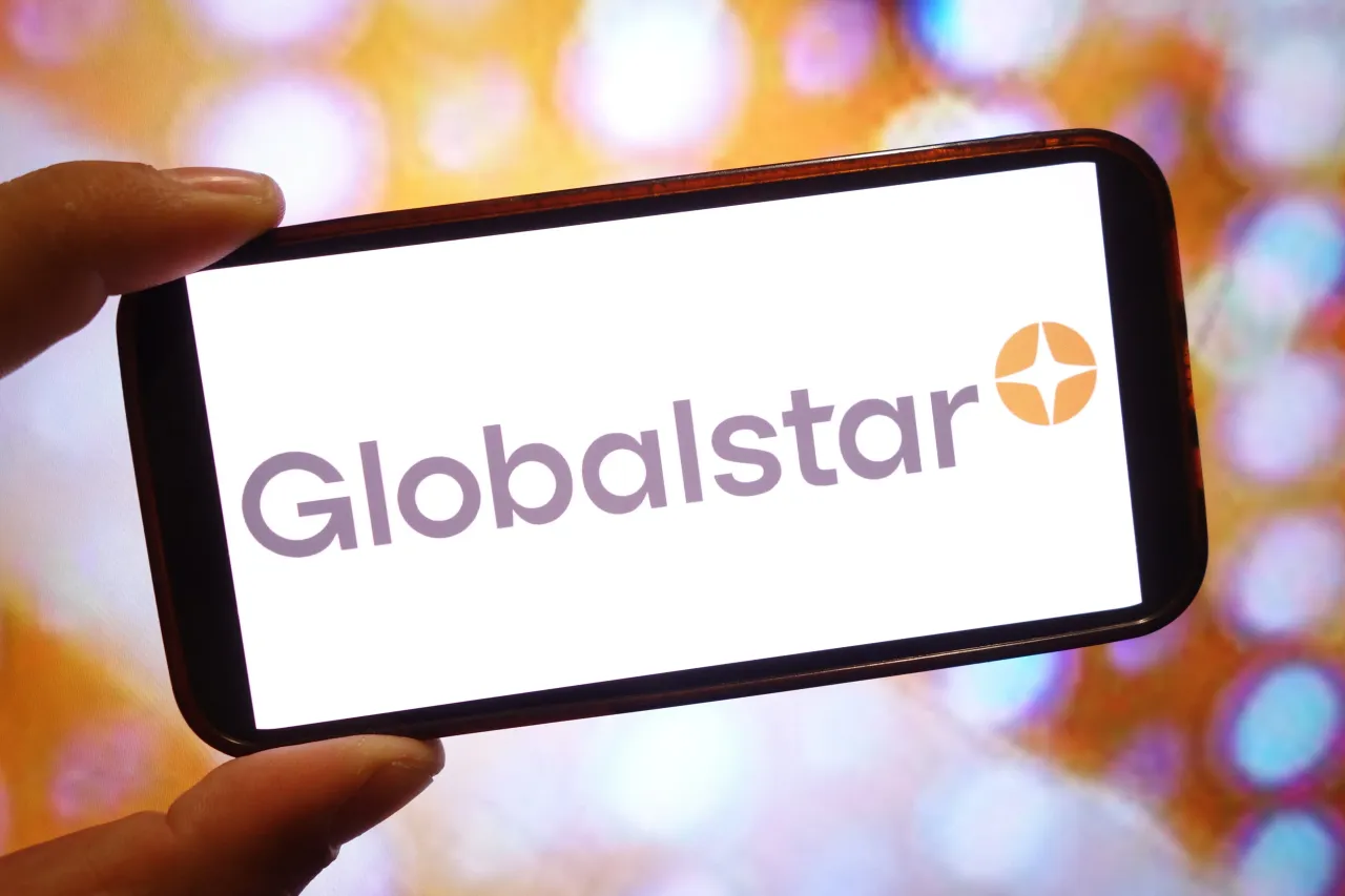  In this photo illustration, a Globalstar company logo is seen displayed on a smartphone screen.