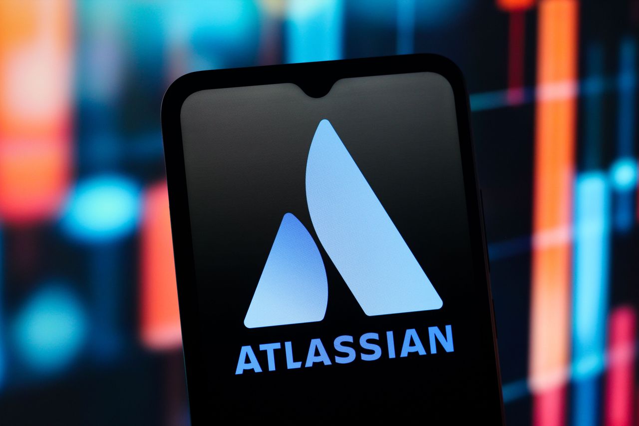 In this photo illustration, the Atlassian Corporation logo is seen displayed on a smartphone screen. (Photo Illustration by Thomas Fuller/SOPA Images/LightRocket via Getty Images)