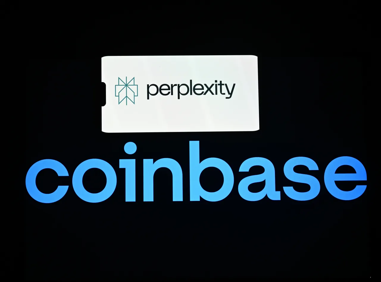 In this photo illustration, the logo of 'Perplexity' is seen on a mobile phone screen and the logo of 'Coinbase' displayed on a computer in Ankara, Turkiye on July 15, 2025. (Photo by Cem Genco/Anadolu via Getty Images)