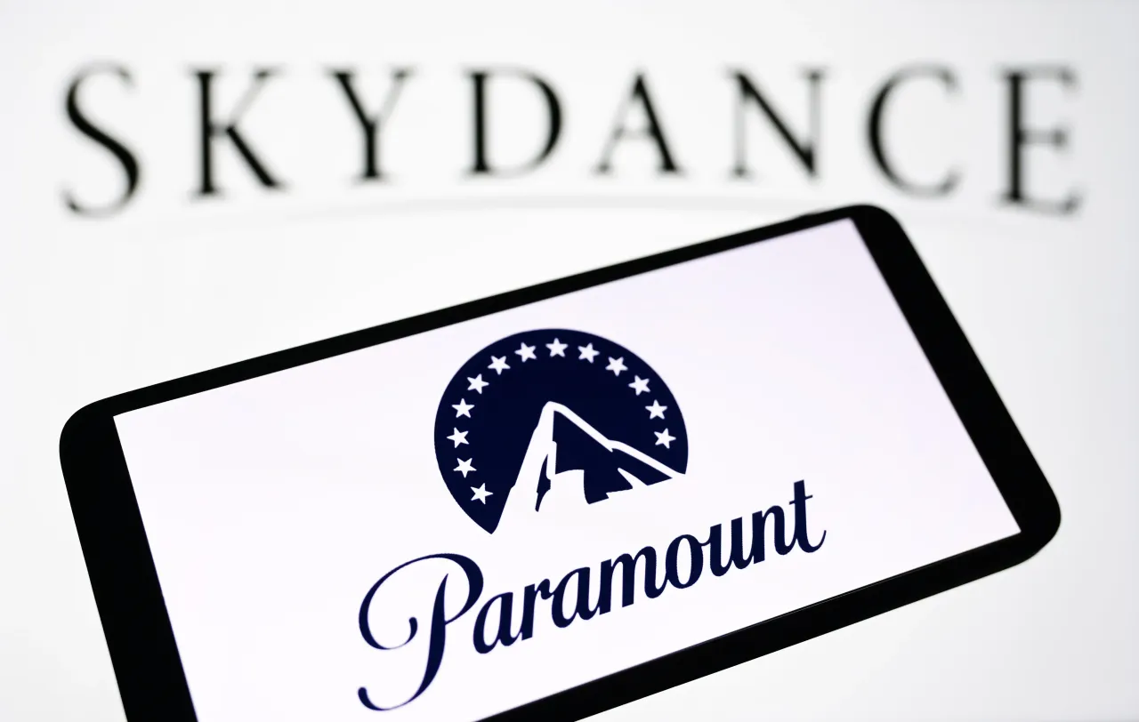 In this photo illustration, the Paramount Global logo is seen on a smartphone and Skydance Media logo in the background.