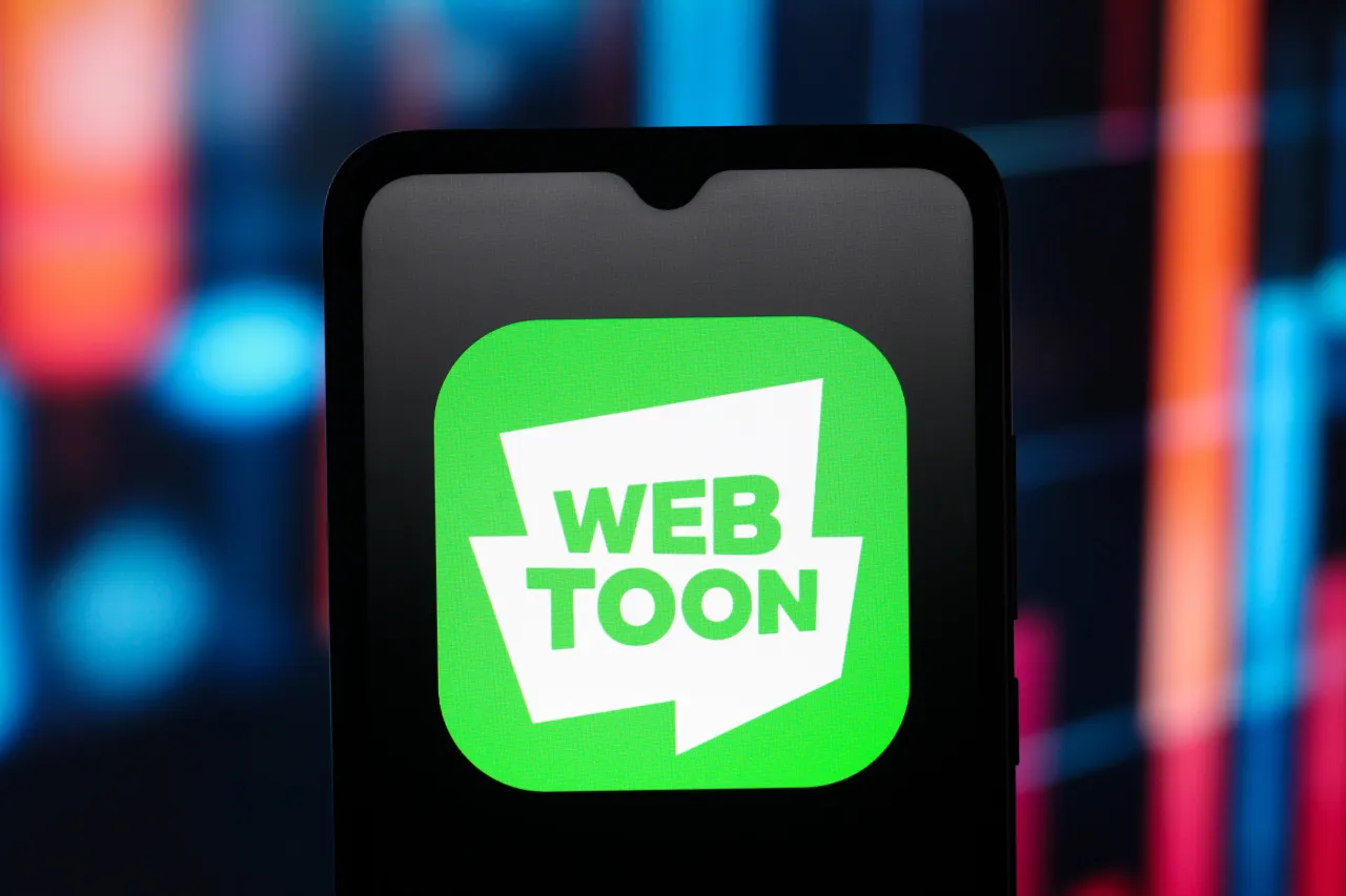 The Webtoon Entertainment (Web Toon) company logo is seen displayed on a smartphone screen. (Photo Illustration by Thomas Fuller/SOPA Images/LightRocket via Getty Images)