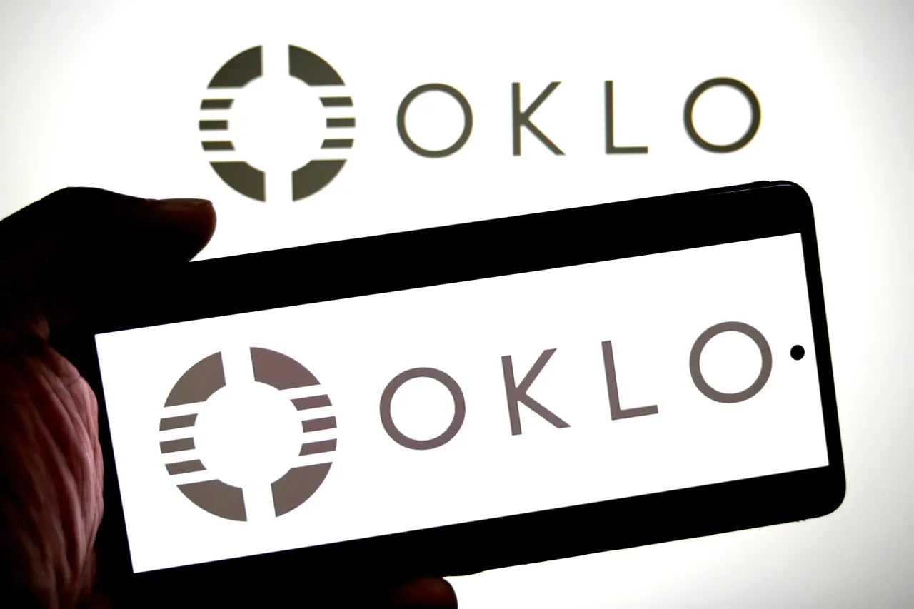 In this photo illustration,an OKLO logo is seen displayed on a smartphone and in the background. (Photo Illustration by Avishek Das/SOPA Images/LightRocket via Getty Images)
