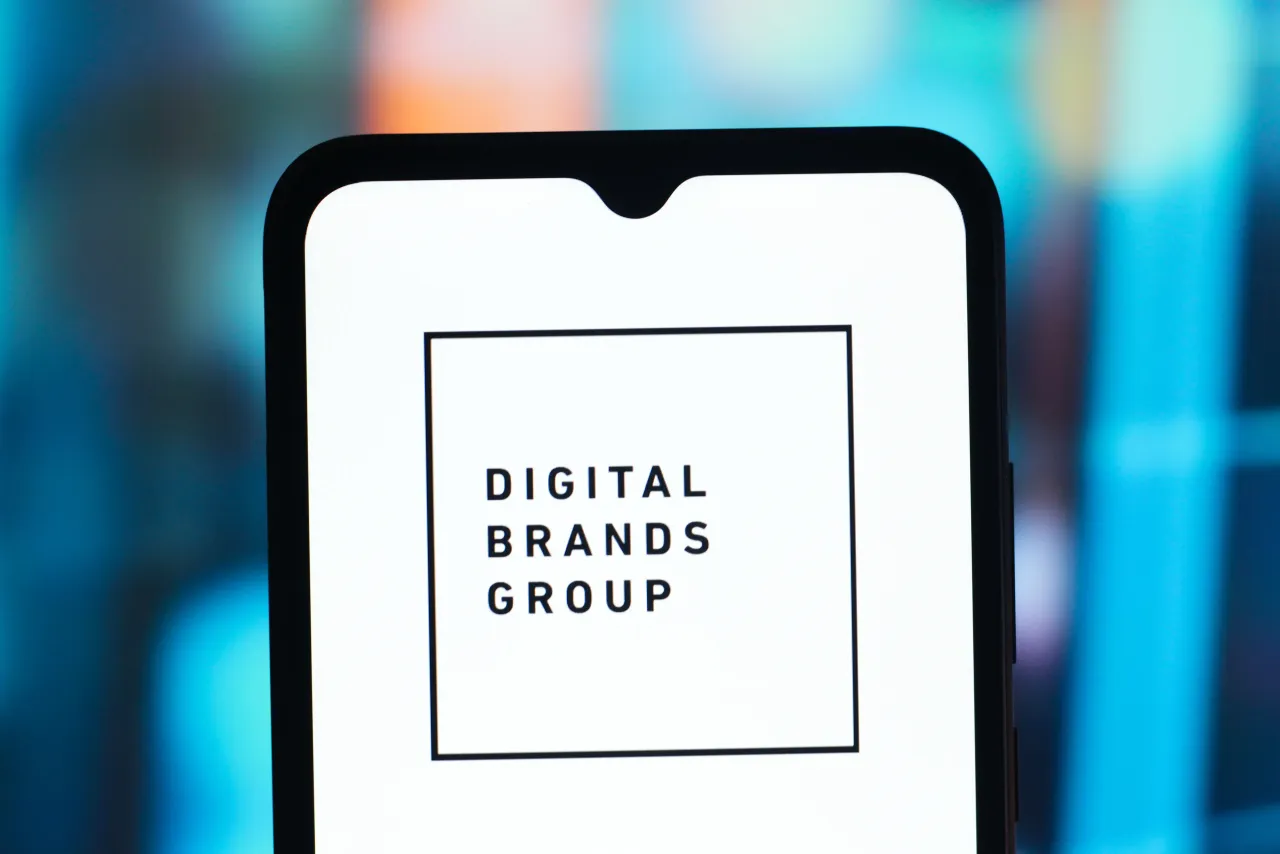 In this photo illustration, the Digital Brands Group (DBGI) logo is seen displayed on a smartphone screen.