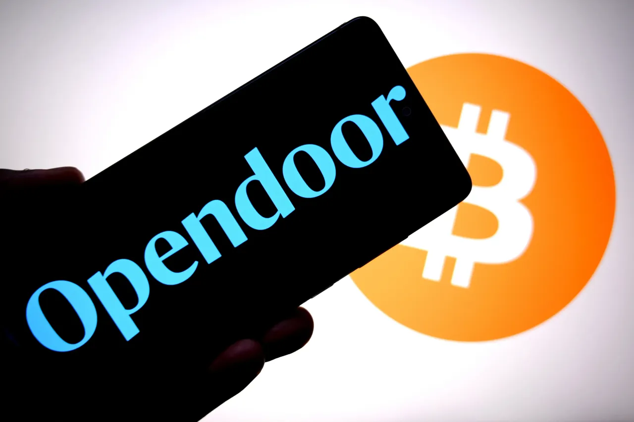In this photo illustration, an Opendoor logo is seen displayed on a smartphone with a Bitcoin logo in the background. (Photo Illustration by Avishek Das/SOPA Images/LightRocket via Getty Images)