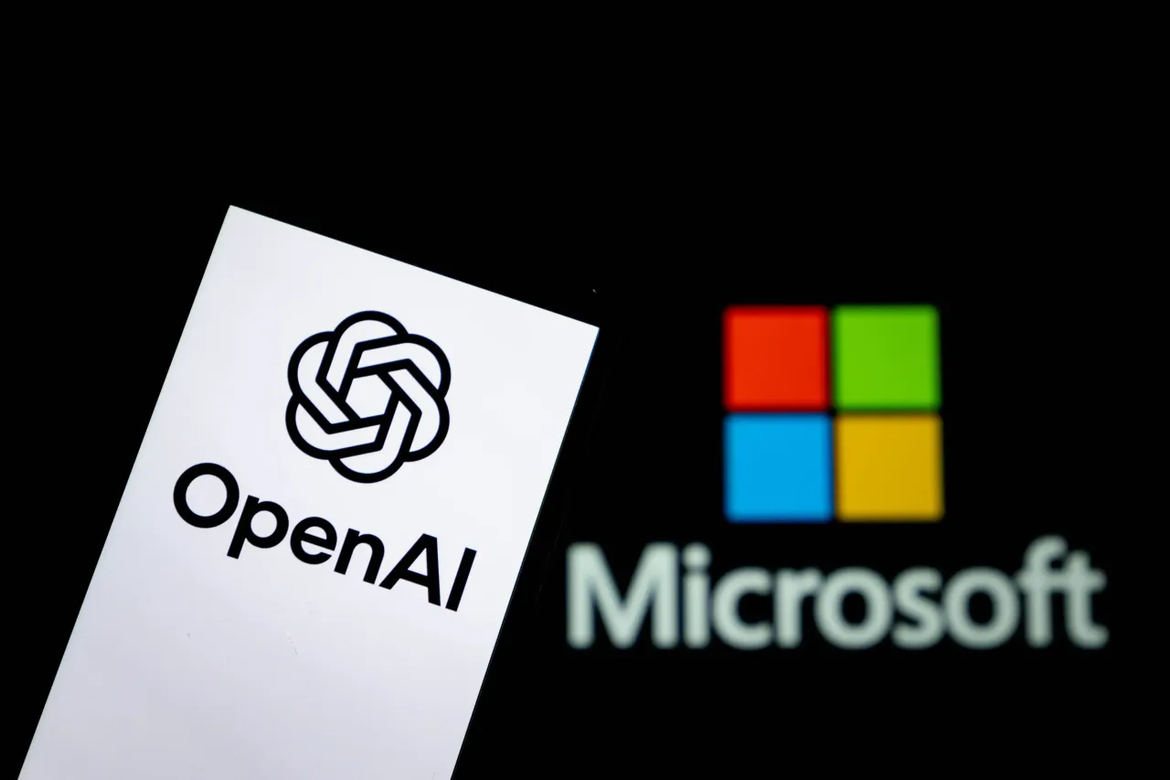 OpenAI logo displayed on a smartphone with the Microsoft logo in the background. (CFOTO/Future Publishing via Getty Images)