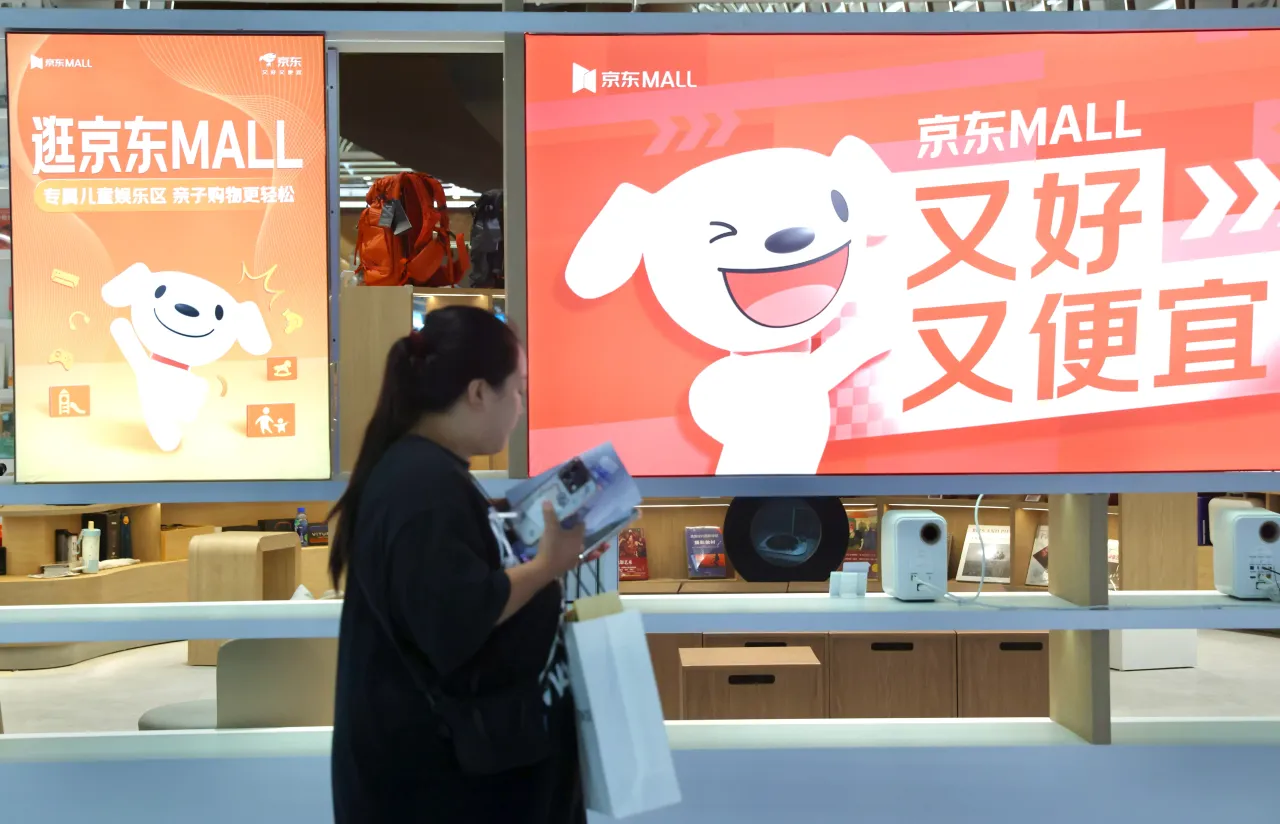 A customer shops at the JD Mall on August 28, 2025 in Beijing, China. (Photo by Yi Haifei/China News Service/VCG via Getty Images)