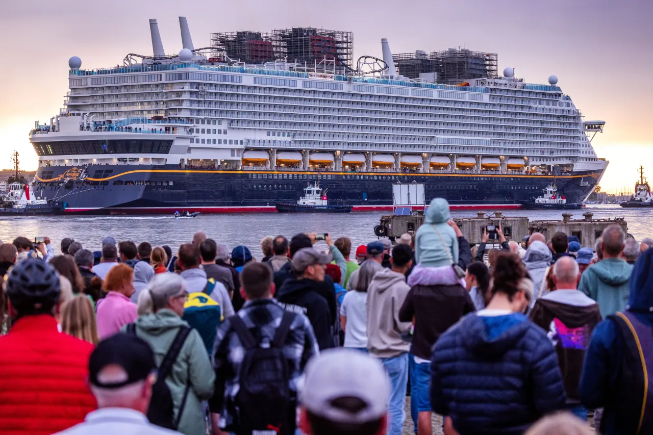 Hundreds of people watch as the cruise ship "Disney Adventure" sets sail in the southwestern Baltic Sea, Germany, on September 01, 2025. (Photo by Jens Büttner/picture alliance via Getty Images)