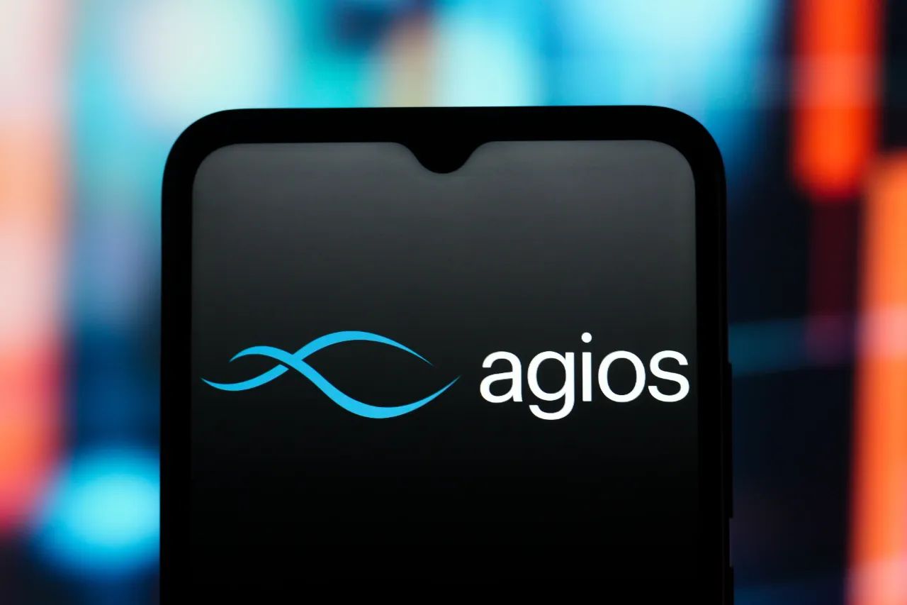 In this photo illustration, the Agios Pharmaceuticals logo is seen displayed on a smartphone screen. (Photo Illustration by Thomas Fuller/SOPA Images/LightRocket via Getty Images)