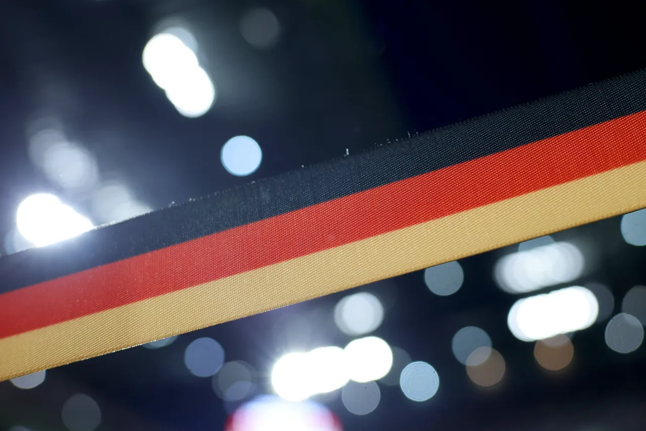 A barrier tape in the colors of the German flag. (Photo by Rolf Vennenbernd/picture alliance via Getty Images)