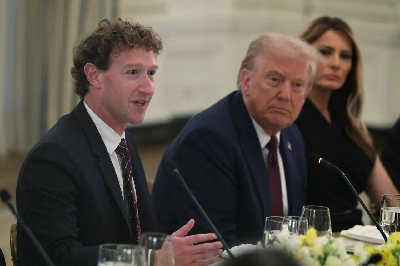 Meta CEO Mark Zuckerberg speaks as U.S. President Donald Trump and first lady Melania Trump listen during a dinner at the State Dining Room of the White House.