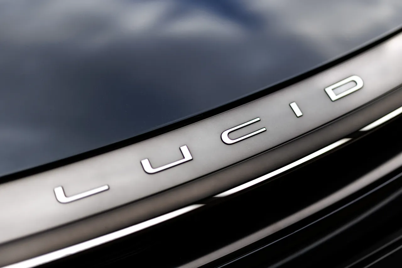 The Lucid brand logo can be seen on a vehicle from the manufacturer at the company's stand at the Open Space of the IAA Mobility, International Motor Show, in Munich on September 11, 2025. (Photo by Matthias Balk/picture alliance via Getty Images)