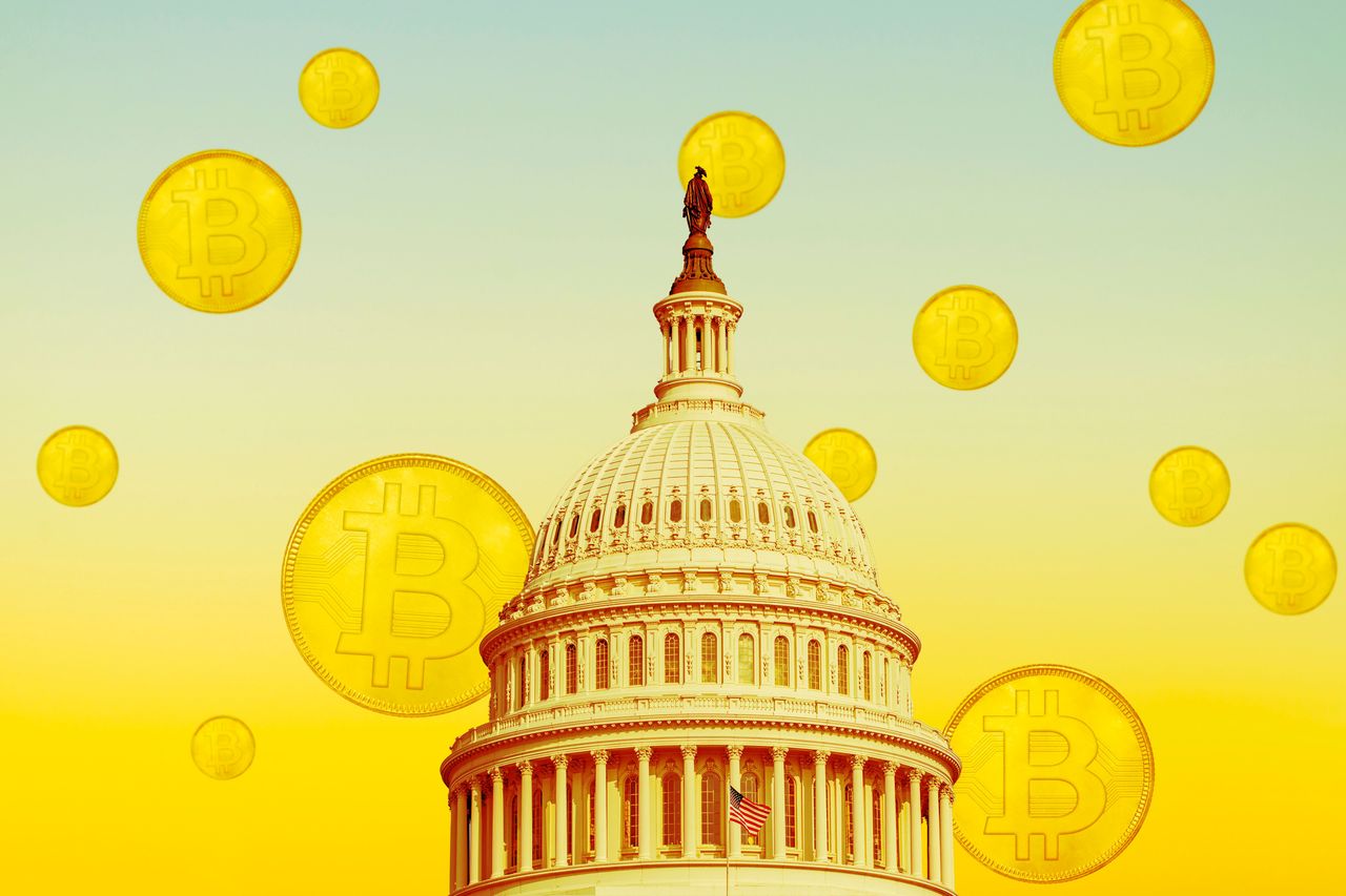 USA, Florida, Boca Raton, United States Capitol building with bitcoins floating in sky. (Via Getty Images)